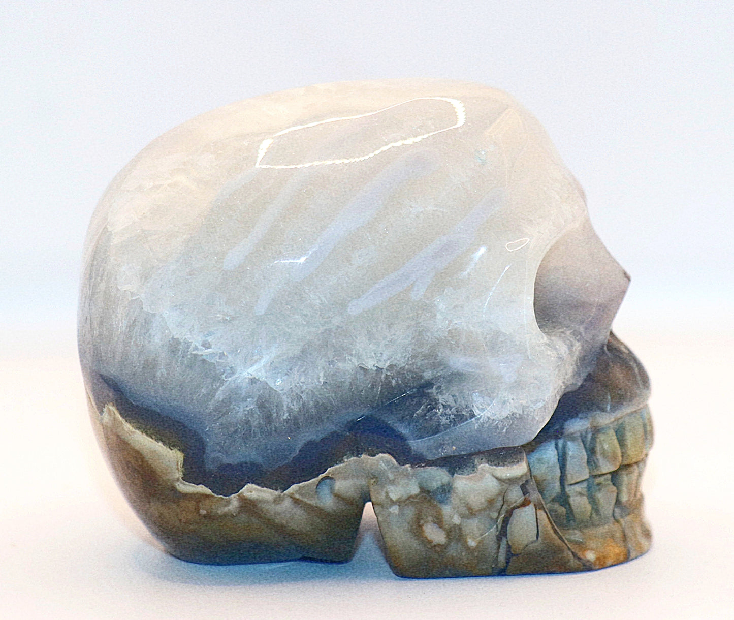 Volcanic Agate Gemstone Curved Skull With UV Reaction